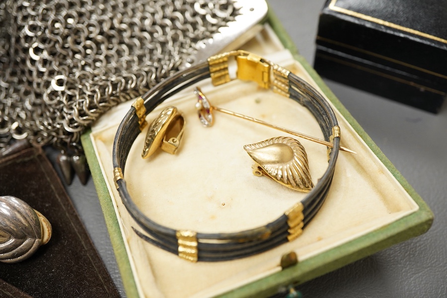 A collection of jewels, comprising: an early 20th century ruby, diamond and seed pearl stick pin, stamped 15ct, length 5.9cm, gross weight approximately 1.5 grams, one diamond deficient; together with a pair of ear clips